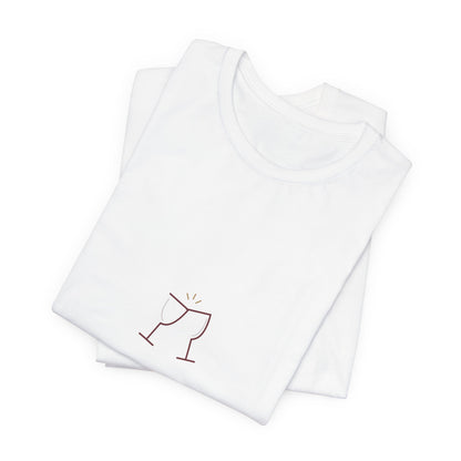 Folded white couple tee showing a close-up of the wine-colored Pour Decisions lettering
