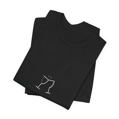 Folded black couple tee showing a close-up of the cream Pour Decisions lettering