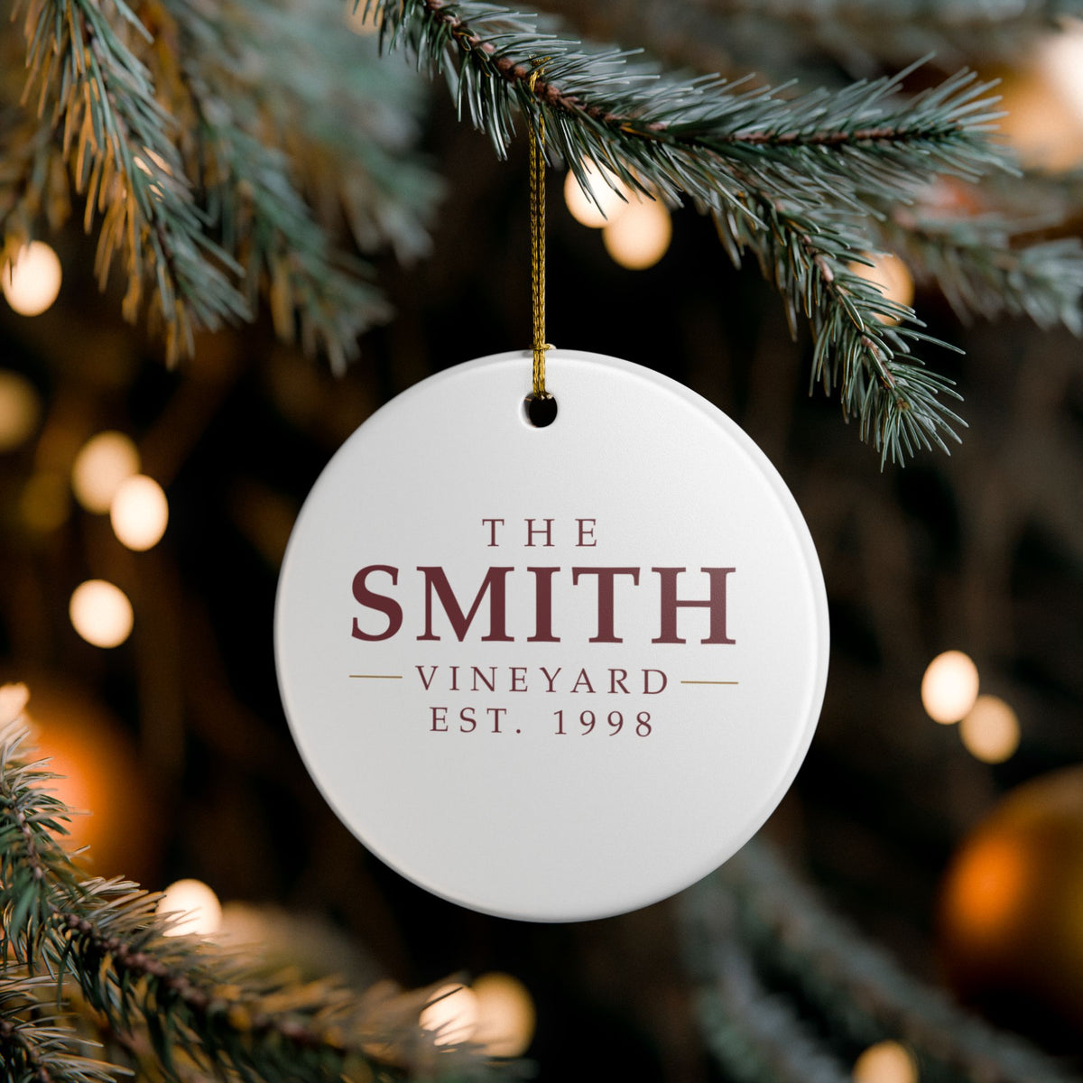 Personalized wine-lover's ornament hanging on a Christmas tree