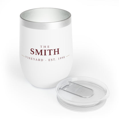 Personalized wine tumbler with its clear slide-closure lid beside it