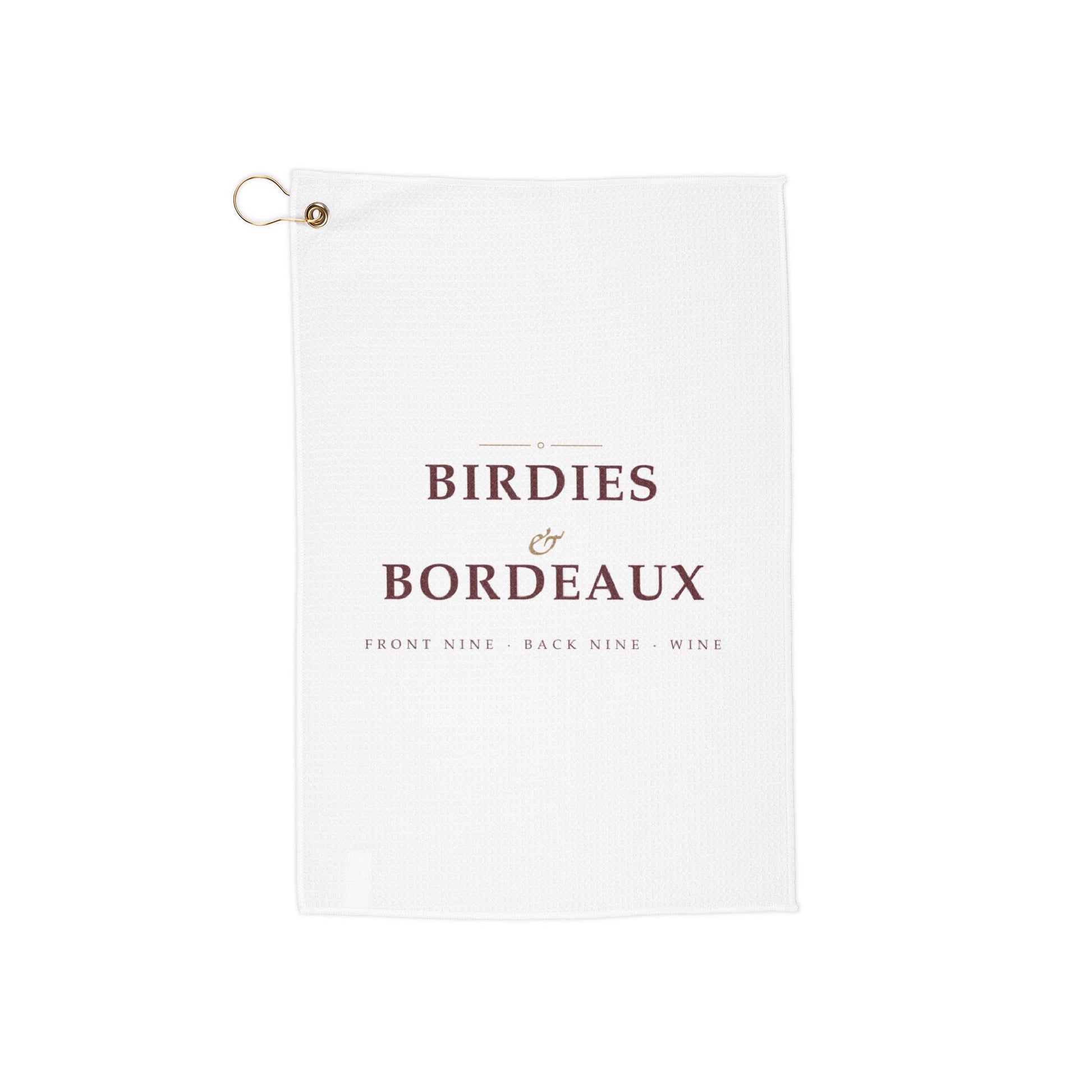 Birdies & Bordeaux golf towel by Designs With Wine, wine-red serif type with a gold script ampersand on white microfiber