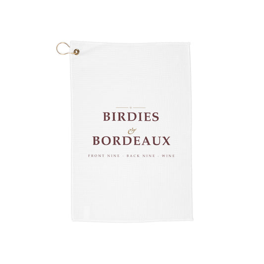 Birdies & Bordeaux golf towel by Designs With Wine, wine-red serif type with a gold script ampersand on white microfiber