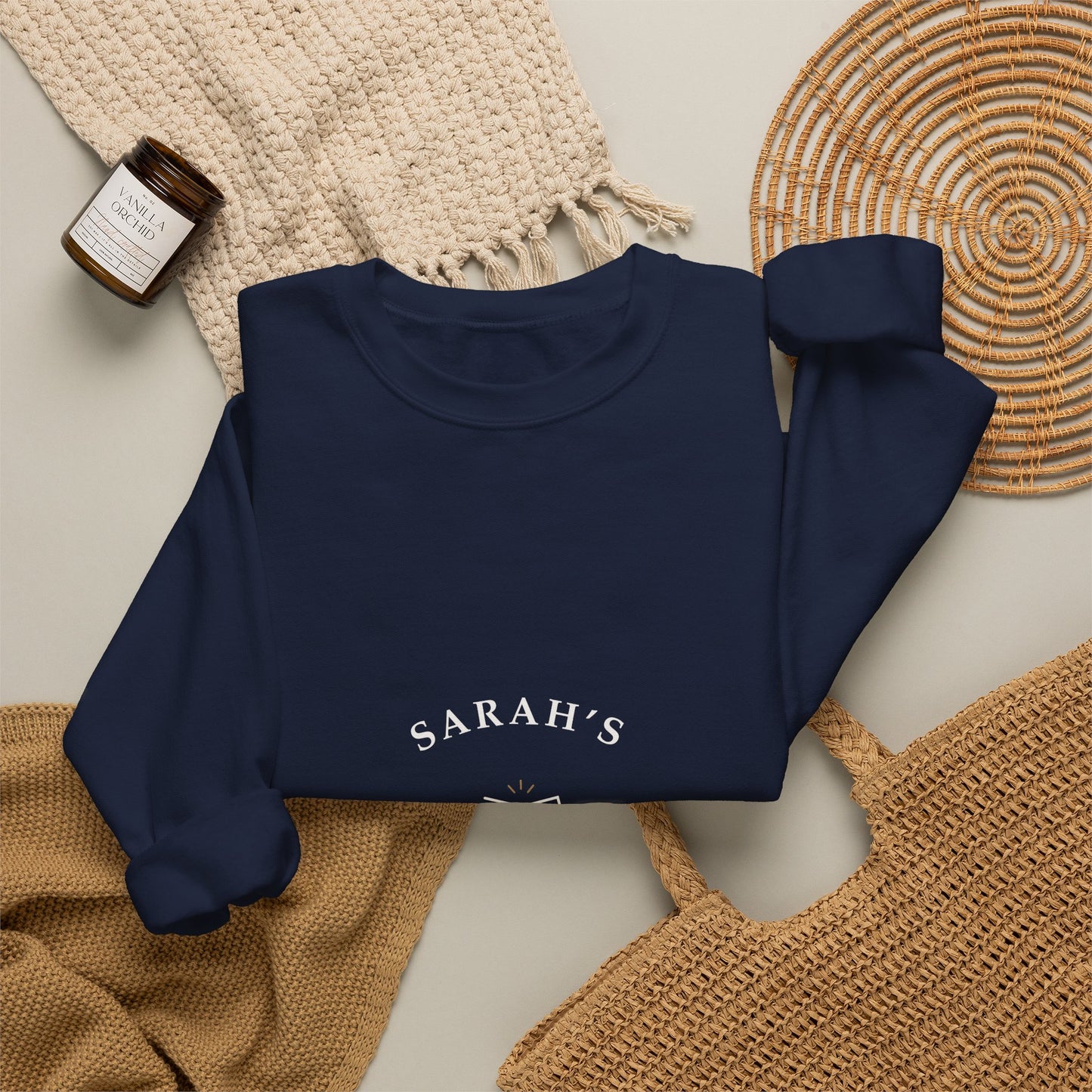 Navy personalized crewneck styled flat with wine-themed props