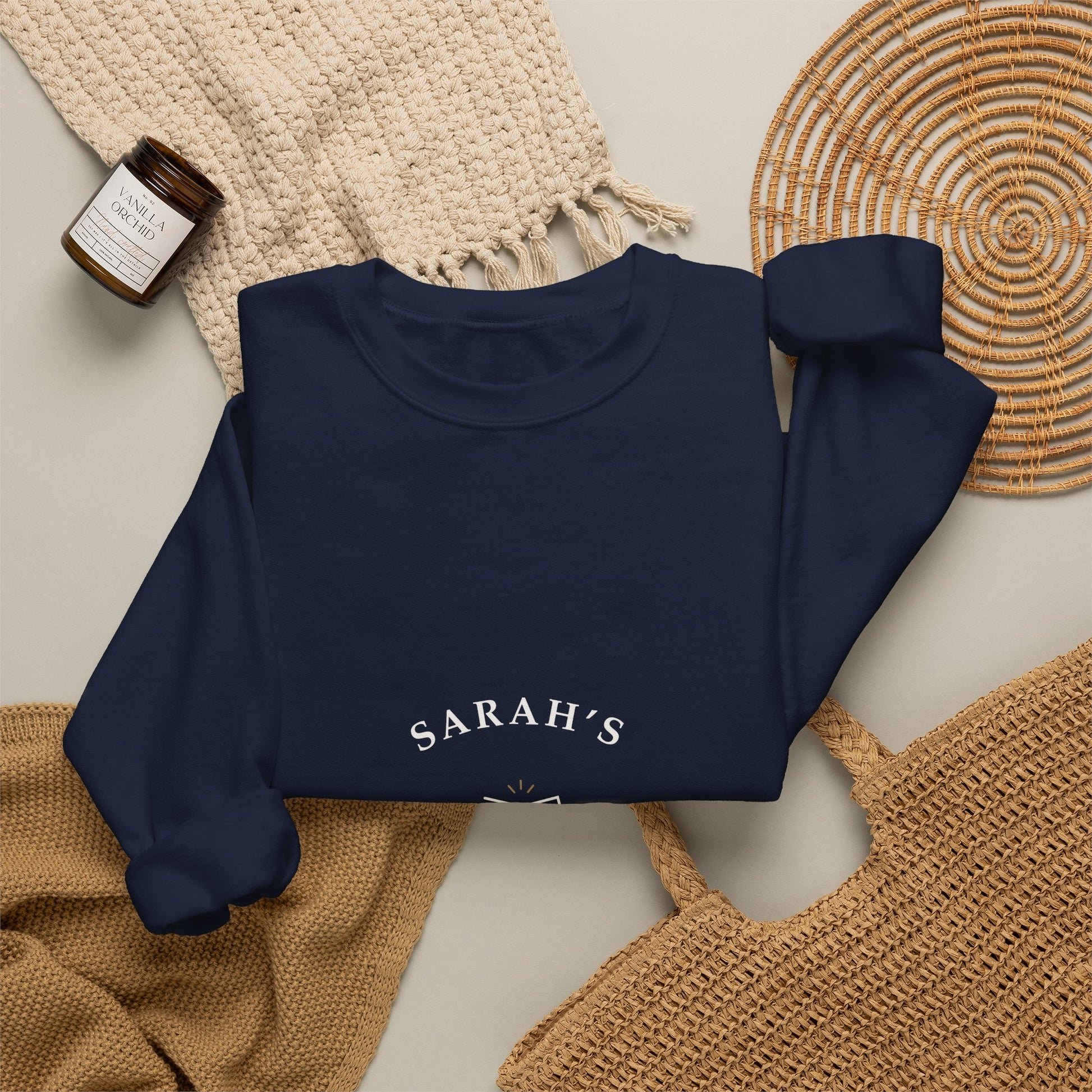 Navy personalized crewneck styled flat with wine-themed props