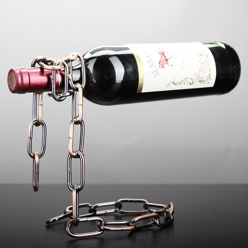 Iron chain wine rack holding a bottle in a floating illusion