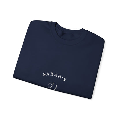 Folded navy crewneck showing a close-up of the cream Weekend Wine Club lettering