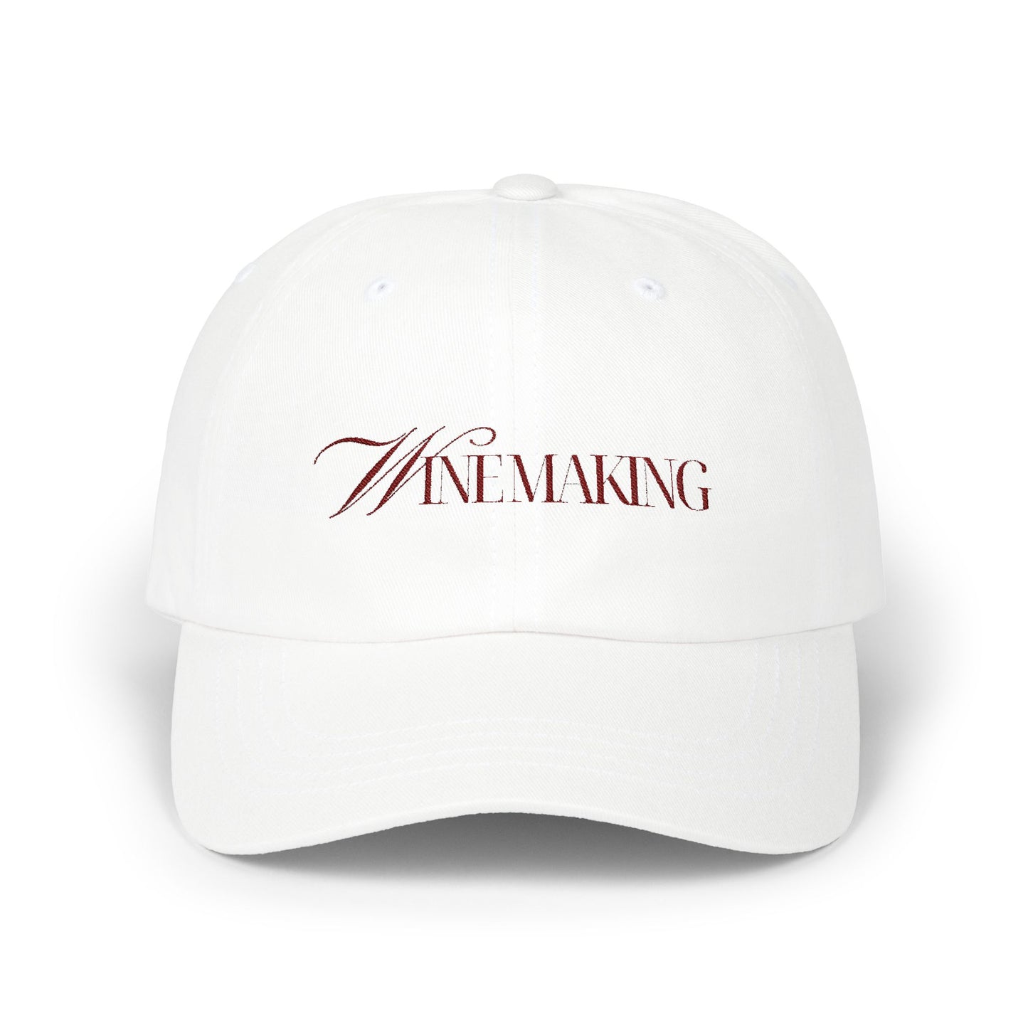 Winemaking vintage editorial logotype in red thread on a cotton classic cap