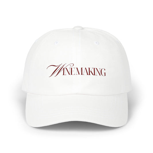 Winemaking vintage editorial logotype in red thread on a cotton classic cap