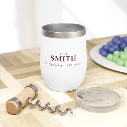 Personalized name wine tumbler on a wooden board with corkscrew and fruit