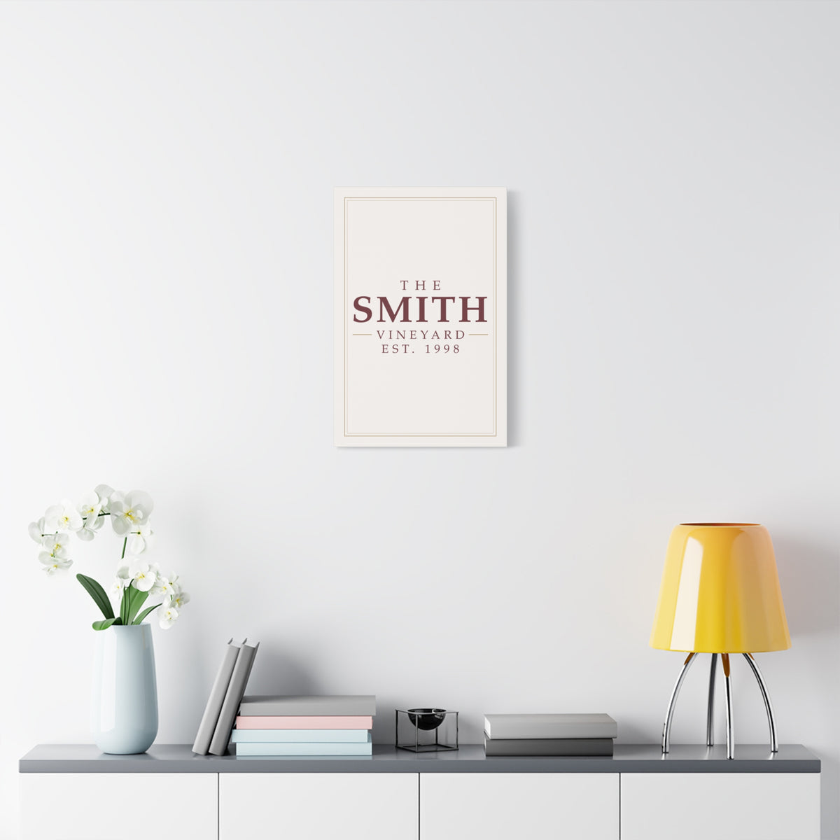 The [Your Name] Vineyard personalized canvas wall art with a custom family name — lifestyle