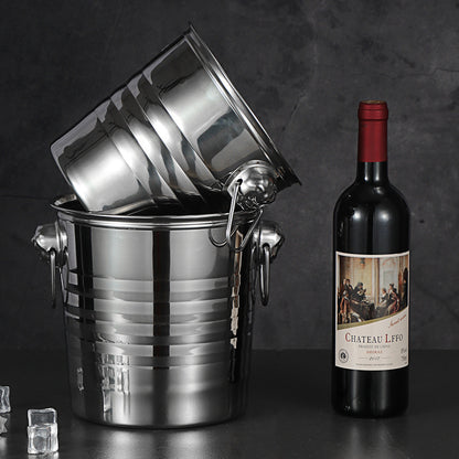 Stainless steel ice bucket with tiger head handles chilling a bottle