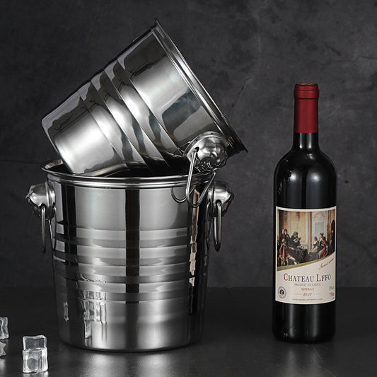 Stainless steel ice bucket with tiger head handles chilling a bottle